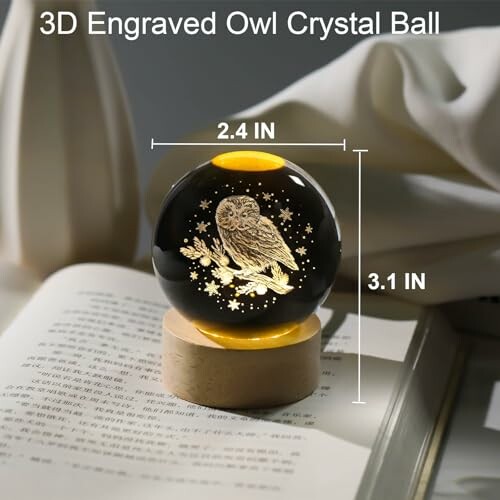 3D engraved owl crystal ball on a wooden base with dimensions.