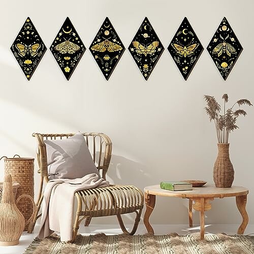 Boho-style wall art with moth designs in a cozy living room.