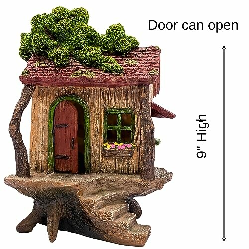 Fairy house with tree stump base and openable door, 9 inches high.