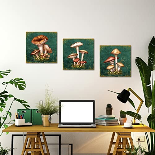 Home office with three mushroom paintings and plants.