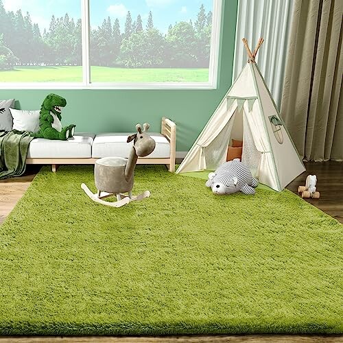 Children's playroom with green rug, white tent, and toys.