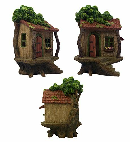 Miniature tree stump houses with green roofs and doors.