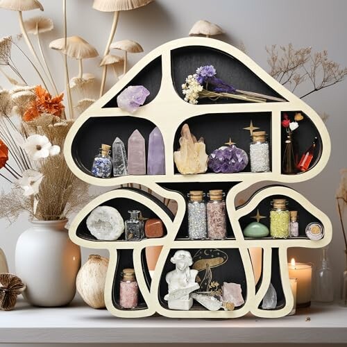 Mushroom-shaped shelf with crystals and jars, surrounded by dried flowers.