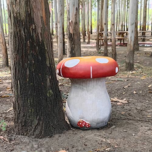 Mushroom-shaped stool beside a tree in a forest