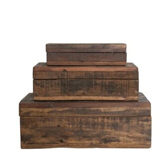 Stack of rustic wooden storage boxes of varying sizes.