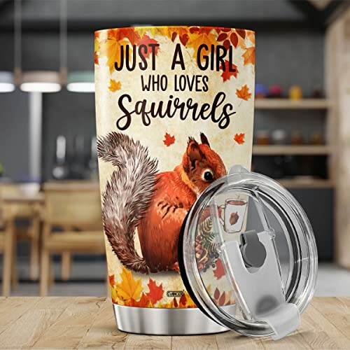 Tumbler with squirrel design and text 'Just a girl who loves squirrels'.