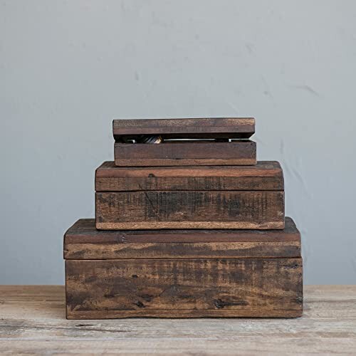 Stacked wooden boxes on a table.