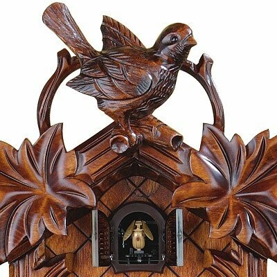 Wooden cuckoo clock with bird carving